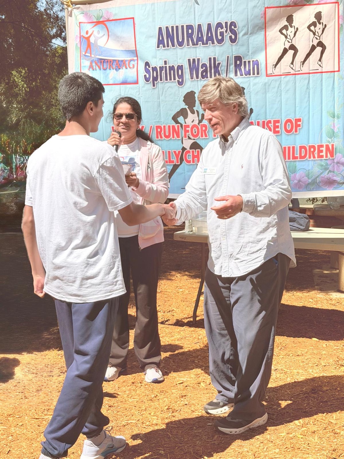Aarav receiving recognition from the Mayor of Morrisville after winning the Anurag Foundation 5K