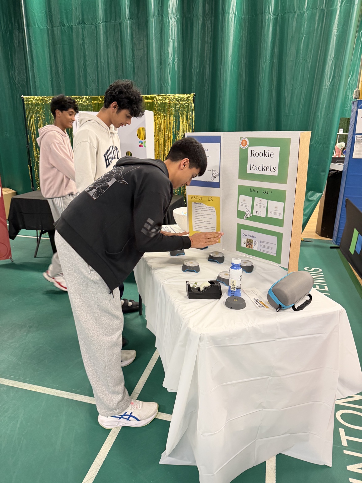 Aarav preparing a Rookie Rackets community information display
